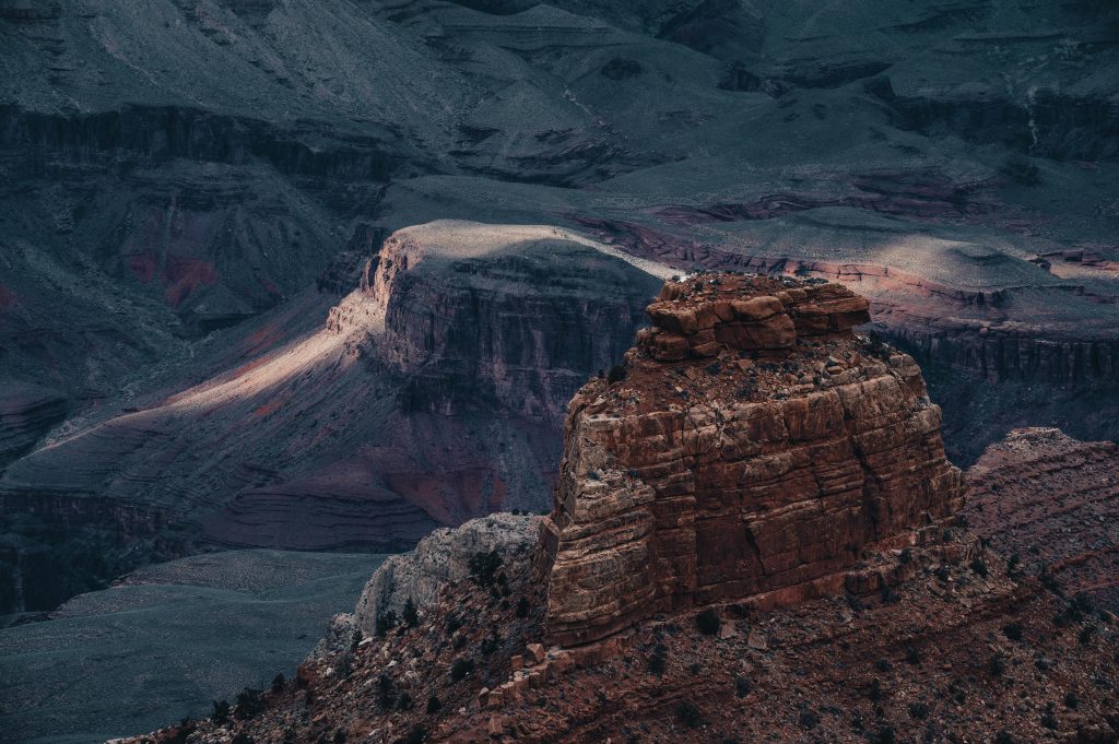 Stunning aerial shot capturing the rugged beauty of the Grand Canyon's eroded cliffs and vast landscapes.