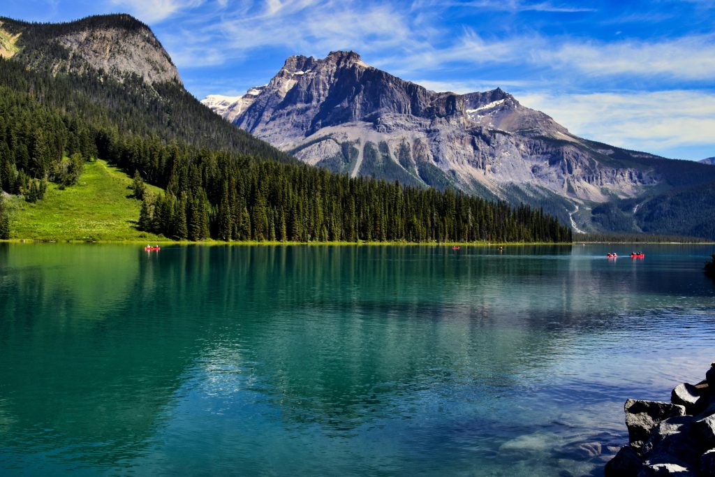 Majestic view of Emerald Lake with reflections and towering mountains in BC, Canada.